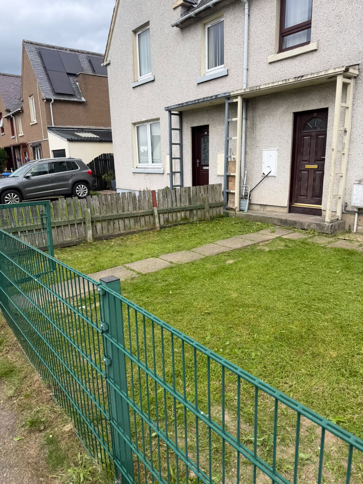 Freshly mown front lawn after regular garden maintenance in the Highlands